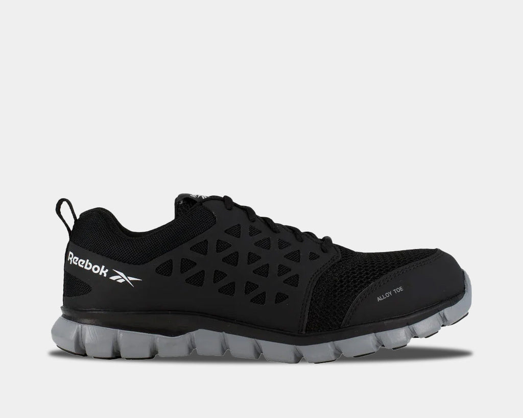 A black work shoe with a low-cut design and alloy toe, featuring a sublite foam midsole for lightweight cushioning.